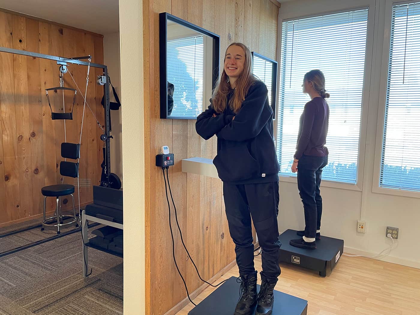 Modern chiropractic examination room with advanced diagnostic equipment