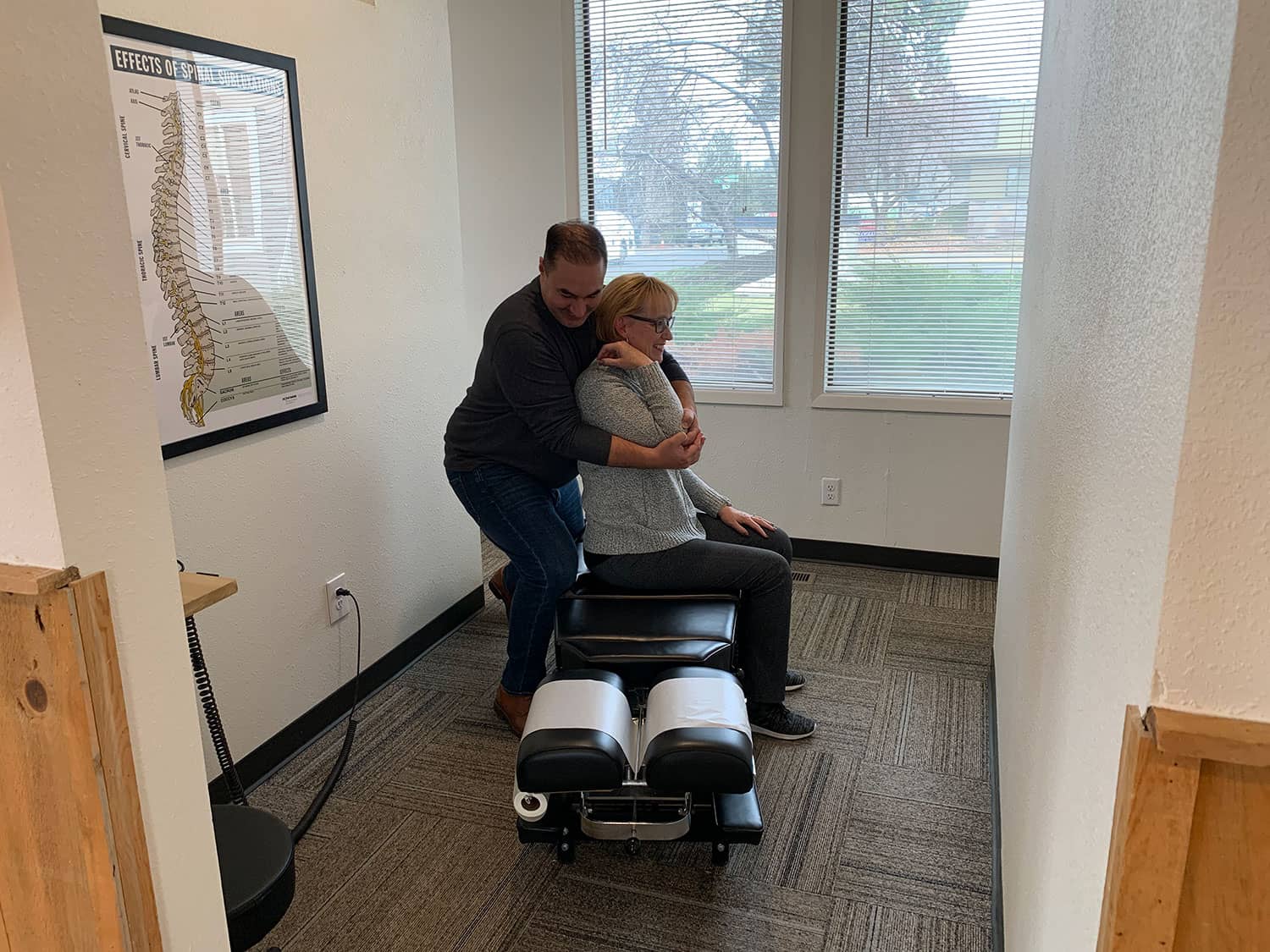woman getting a back adjustment at Elevation Spine Center in Bend, Oregon
