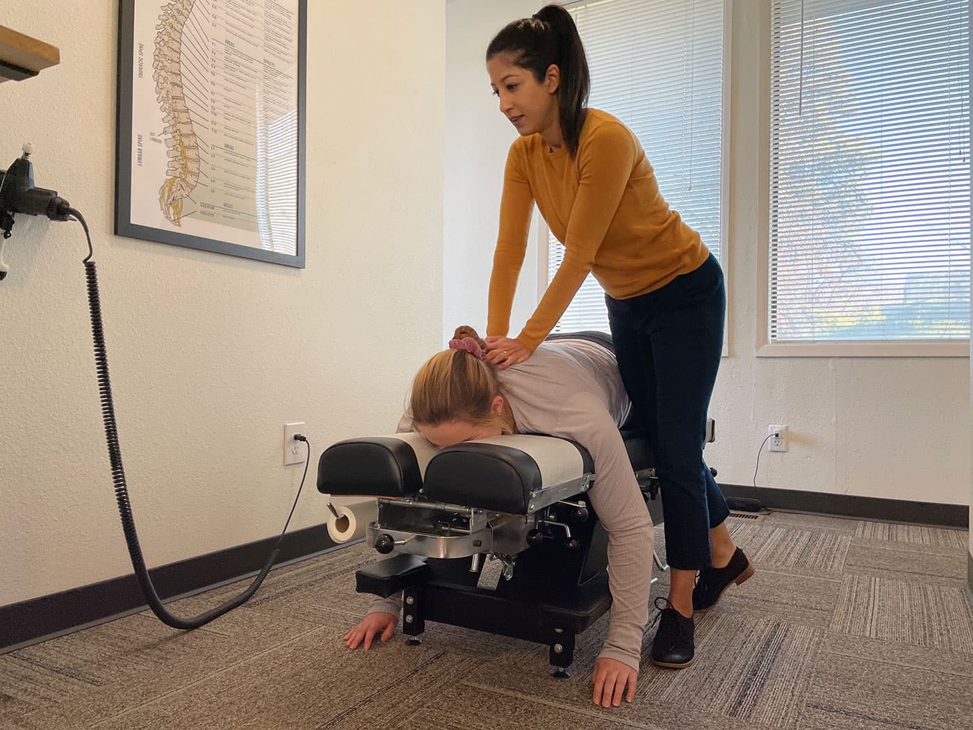 Chiropractic care performed on a young woman at Elevation Spine Center in Bend, Oregon