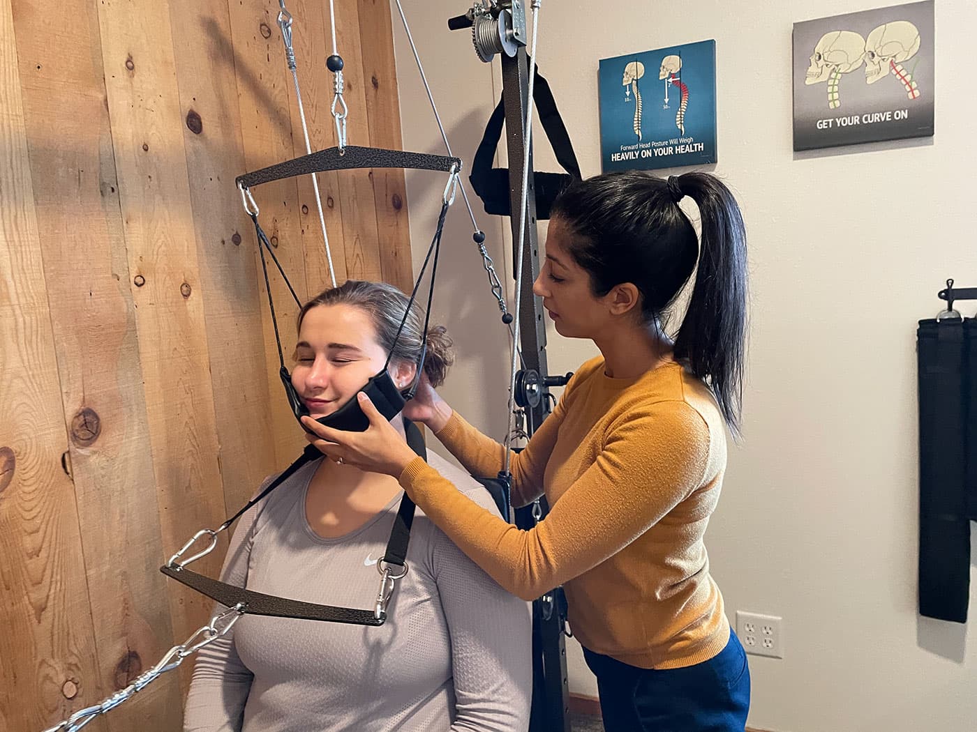 Young woman receiving whiplash treatment at Elevation Spine Center in Bend, Oregon